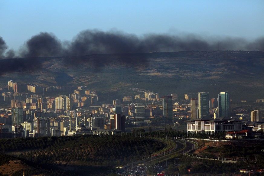 Smoke billows from an area near the presidential palace, right, in Ankara, Turkey, Saturday, July 16, 2016. Forces loyal to Turkey&#039;s President Recep Tayyip Erdogan quashed a coup attempt in a nig ...