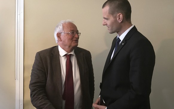 German judge Hans-Joachim Eckert, left, and Swiss prosecutor Cornel Borbely speak after a FIFA ethics press conference in Manama, Bahrain, Wednesday, May 10, 2017. Hundreds of prosecutions of suspecte ...