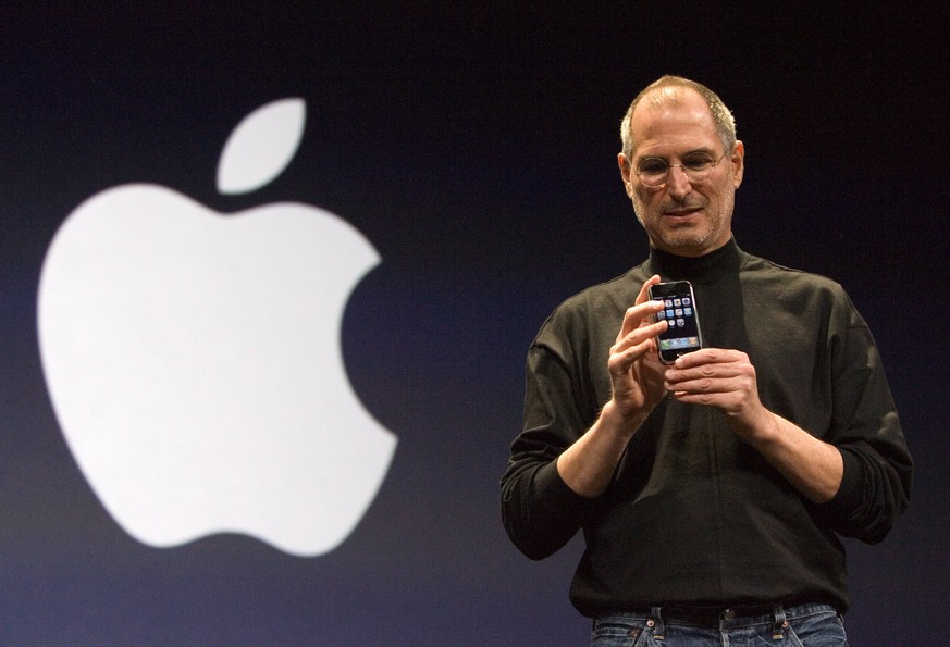 epa06054015 (FILE) - Apple Inc. CEO and co-founder, Steve Jobs poses with the new Apple iPhone after his keynote at the Macworld Expo in San Francisco, California, 09 January 2007. The revolutionary m ...