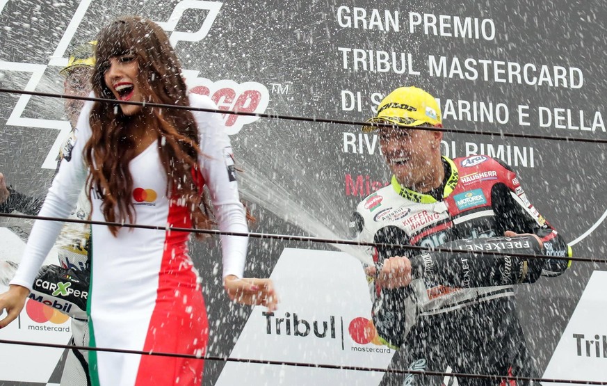 epa06196236 Swiss rider Dominique Aegerter of Kiefer Racing celebrates on the podium after winning the Moto2 Grand Prix of San Marino and Riviera of Rimini at Misano circuit, in Misano Adriatico, Ital ...