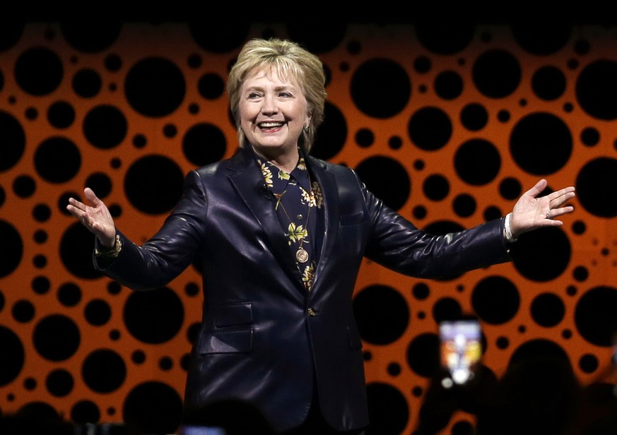 FILE - In this March 28, 2017, file photo, former Secretary of State Hillary Clinton gestures while speaking before the Professional Businesswomen of California in San Francisco. Clinton will speak at ...