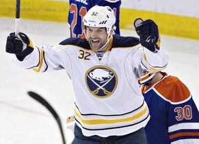 Buffalo Sabres&#039; John Scott (32) celebrate a goal against the Edmonton Oilers during the second period of an NHL hockey game in Edmonton, Alberta, on Thursday, March 20, 2014. (AP Photo/The Canadi ...