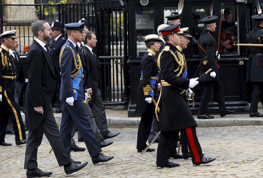 Britain&#039;s King Charles III, Princess Anne, Prince Andrew and Prince Edward walk as the coffin of Queen Elizabeth II leaves Westminster Hall for the State Funeral at Westminster Abbey, London Mond ...