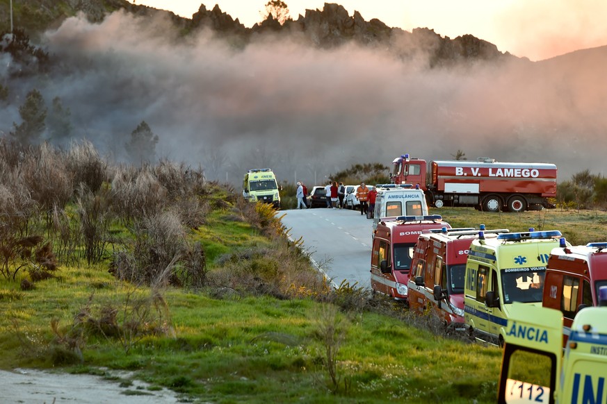 epa05889430 Emergency workers at the site of a fireworks factory, in Avoes, Lamego, Portugal, 04 April 2017 (issued 05 April 2017). At least five people died and three were still missing following sev ...