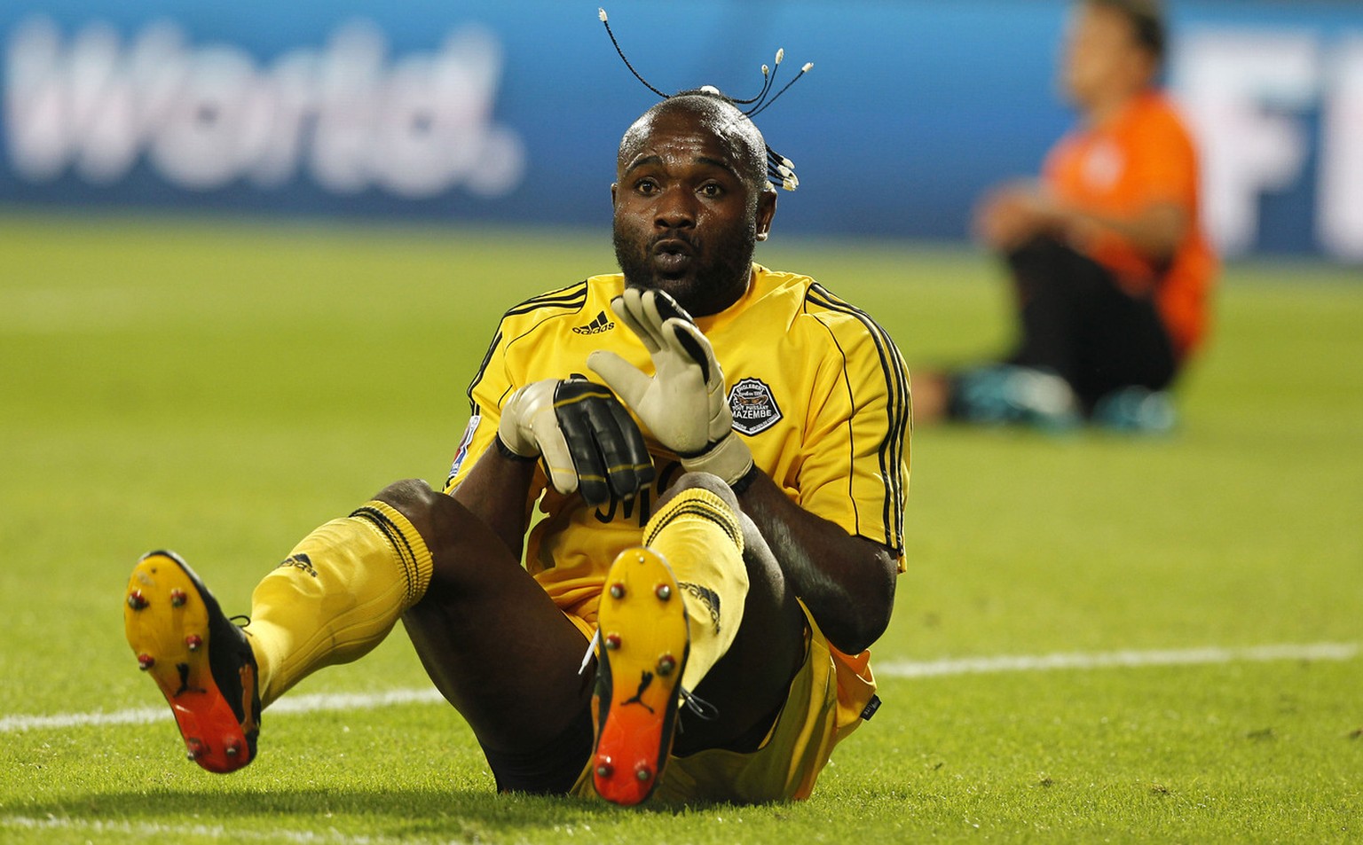 Congolese soccer club TP Mazembe&#039;s goalkeeper Muteba Kidiaba celebrates winning against Mexican Pachuca club in their FIFA Club World Cup qualifying soccer match at the Mohammed Bin Zayed Stadium ...