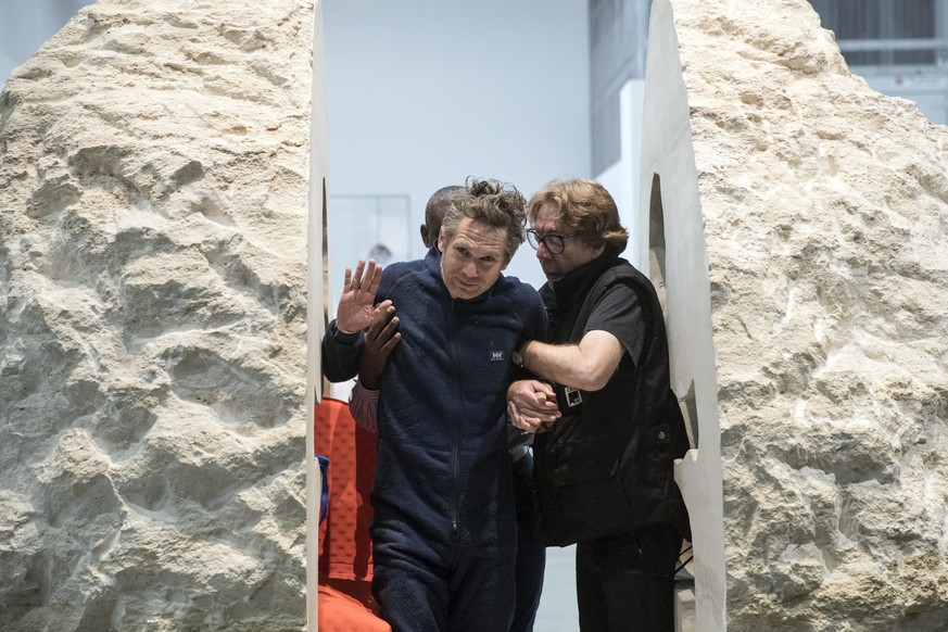 epa05822832 French performance artist Abraham Poincheval (C) is helped by medical staff on leaving a 12-tonne stone boulder within which he lived for a week as a performance entitled &#039;Pierre&#039 ...