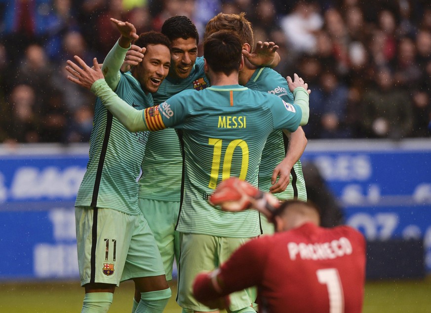 Football Soccer - Alaves v Barcelona - Spanish La Liga Santander - Mendizorroza stadium, Vitoria, Spain, 11/02/17 Barcelona&#039;s Luis Suarez (C) celebrates with team mates Neymar (L), Lionel Messi a ...
