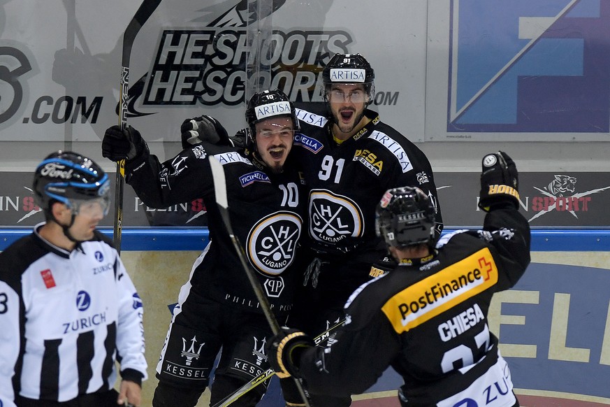 Lugano’s player Alessio Bertaggia, left, celebrateS the 2 - 0 goal with Lugano’s player Julian Walker, center, and Lugano’s player Alessandro Chiesa, right, during the preliminary round game of Nation ...