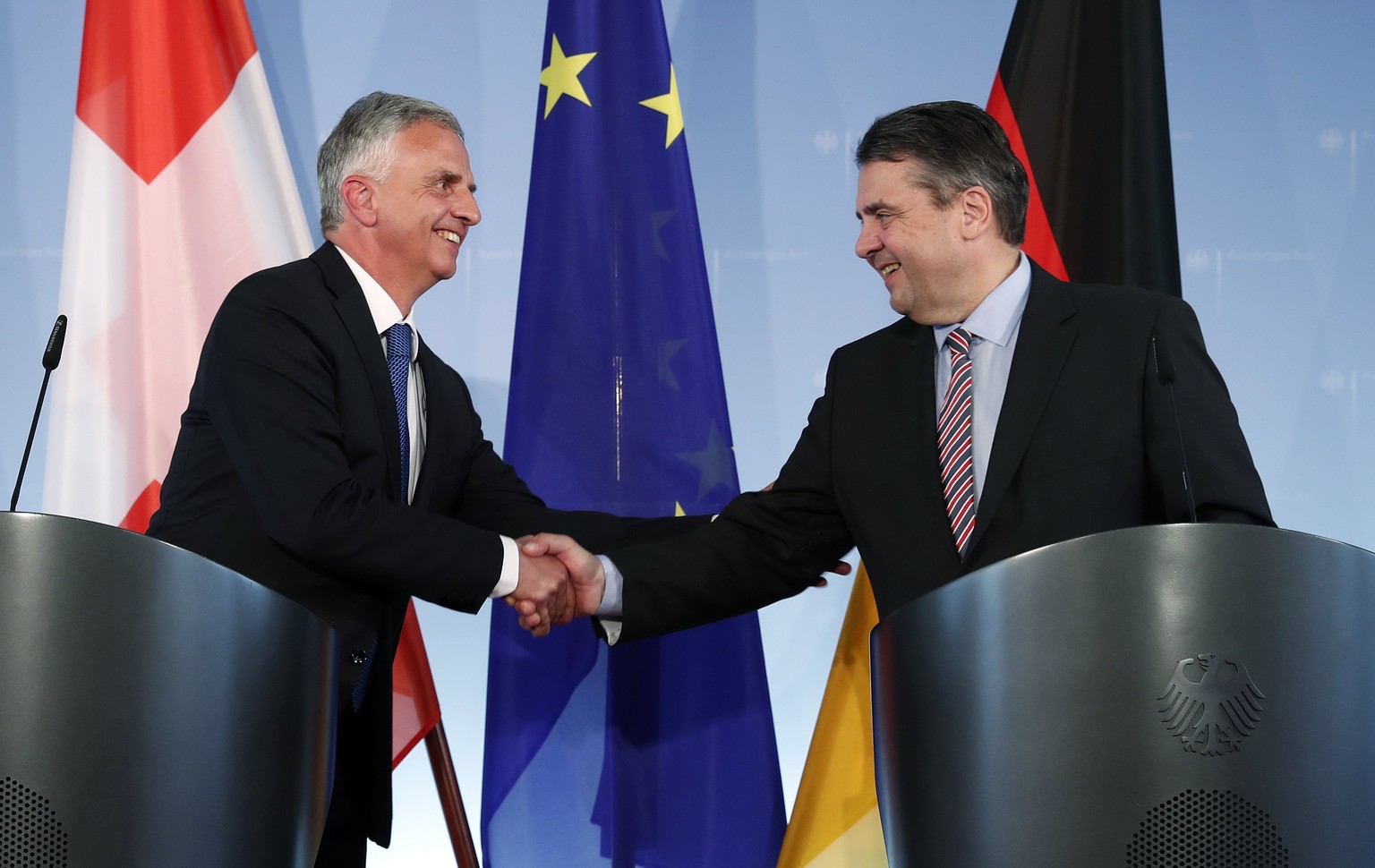 epa05879346 German Foreign Minister Sigmar Gabriel (R) shakes hands with Swiss Foreign Minister Didier Burkhalter (L) during their joint press conference in the Foreign Office in Berlin, Germany, 30 M ...