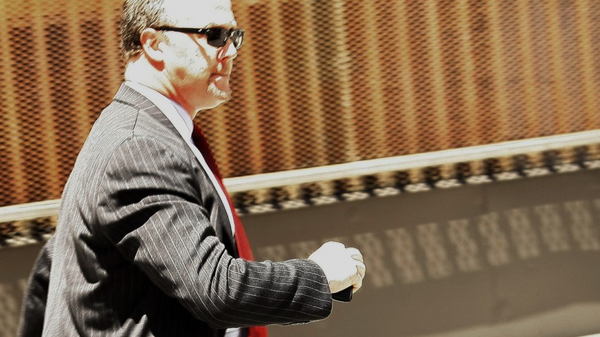 Former UBS banker Bradley Birkenfeld leaves the Fort Lauderdale, Fla. federal court building Friday, Aug. 21, 2009 in Fort Lauderdale Fla. after being sentenced to 40 months in federal prison. (AP Pho ...