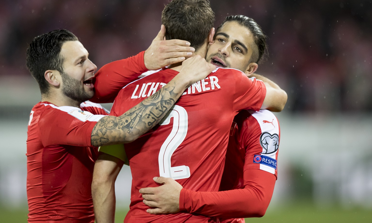 Swiss defender Stephan Lichtsteiner, center, celebrates after scoring a goal with Swiss forward Renato Steffen, left, and Swiss defender Ricardo Rodriguez, right, during the 2018 Fifa World Cup group  ...