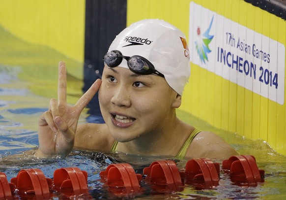 China&#039;s Chen Xinyi reacts after winning the women&#039;s 50m freestyle swimming final at the 17th Asian Games in Incheon, South Korea, Friday, Sept. 26, 2014. (AP Photo/Lee Jin-man)