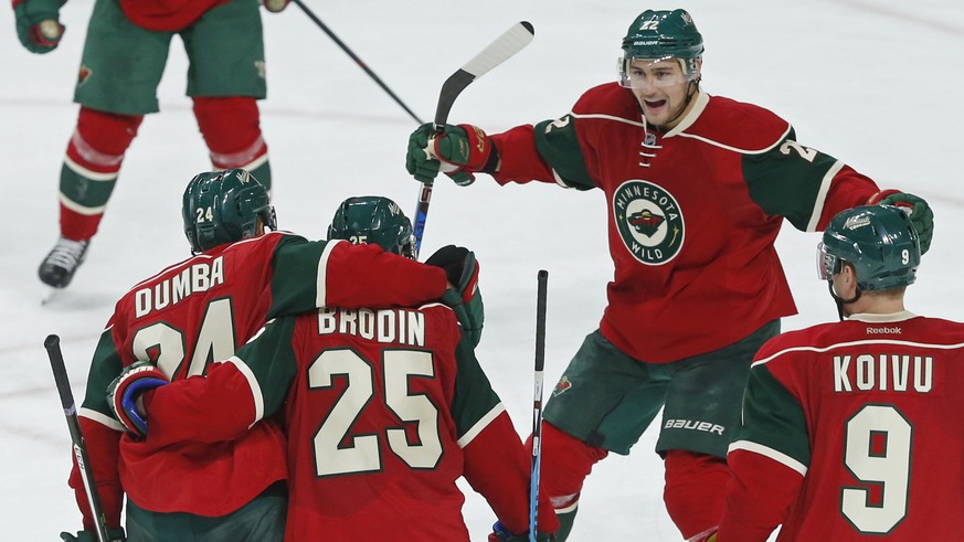 Minnesota Wild&#039;s Nino Niederreiter, top, of Switzerland, skates in to congratulate Jonas Brodin (25), who scored against the Winnipeg Jets during the third period of an NHL hockey game Wednesday, ...