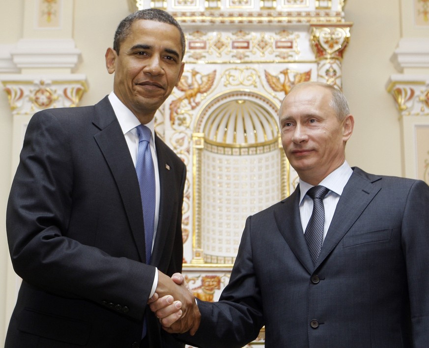 FILE - In this July 7, 2009 file photo, President Barack Obama shakes hands with then-Russian Prime Minister Vladimir Putin in Moscow. With global anxiety rising, President Barack Obama is searching f ...