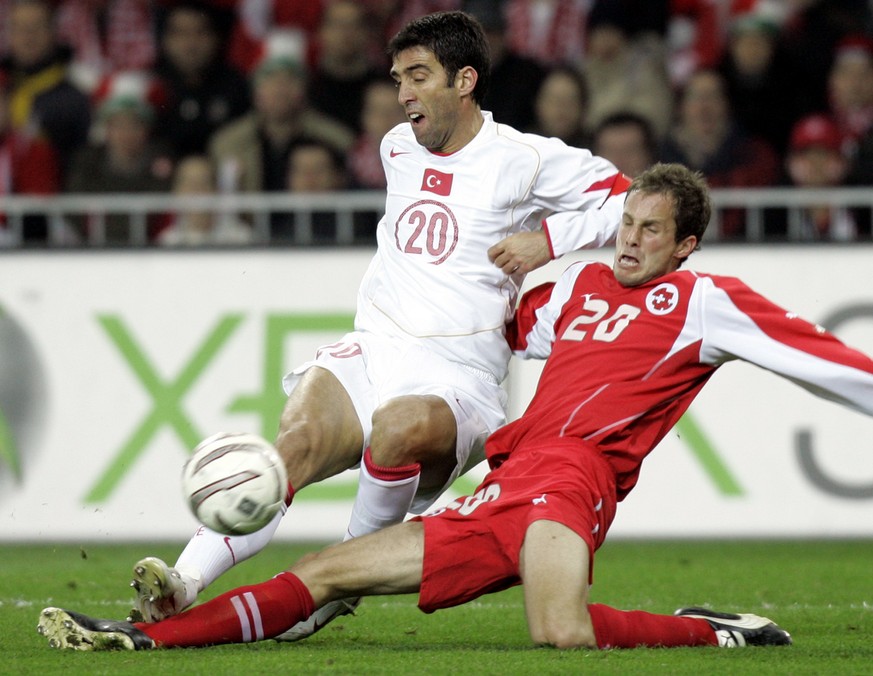 Turkey&#039;s Hakan Sukur, left, fights for the ball with Switzerland&#039;s Patrick Muller at the Stade de Suisse Wankdorf in Bern, Switzerland, Saturday, Nov. 12, 2005, during a World Cup 2006 quali ...