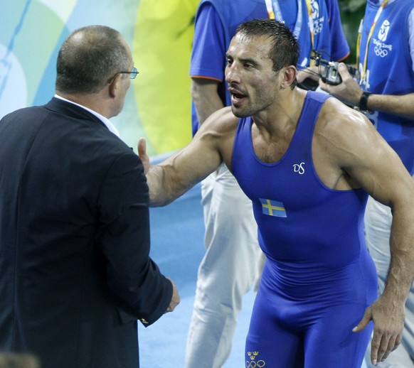 Sweden&#039;s Ara Abrahamian shouts at wrestling officials after a contraversial match decision during his 84 kilogram greco-roman wrestling match against Italy&#039;s Andrea Minguzzi at the Beijing 2 ...