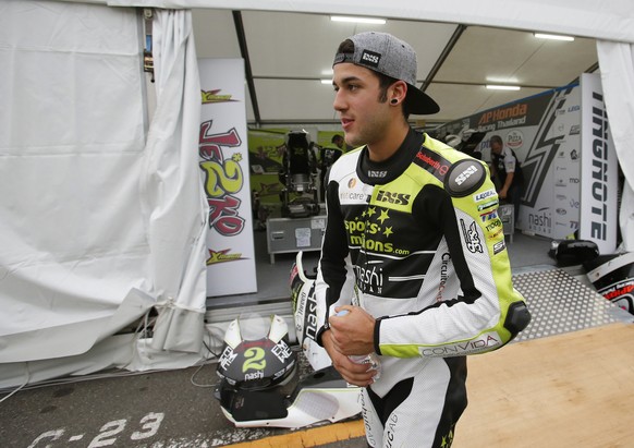 Moto2 rider Jesko Raffin of Switzerland walks in front of his garage after the third free practice session for the Japanese Motorcycle Grand Prix at the Twin Ring Motegi circuit in Motegi, north of To ...