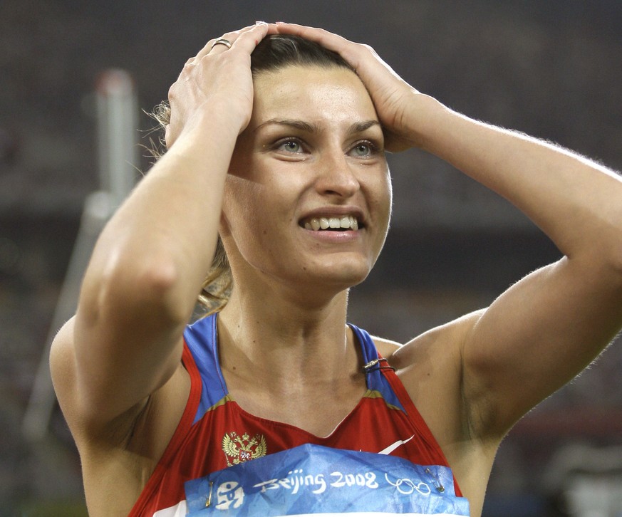 FILE - In this Aug. 23, 2008 file photo Russia&#039;s Anna Chicherova reacts after making a clearance in the final of the women&#039;s high jump during the athletics competitions in the National Stadi ...