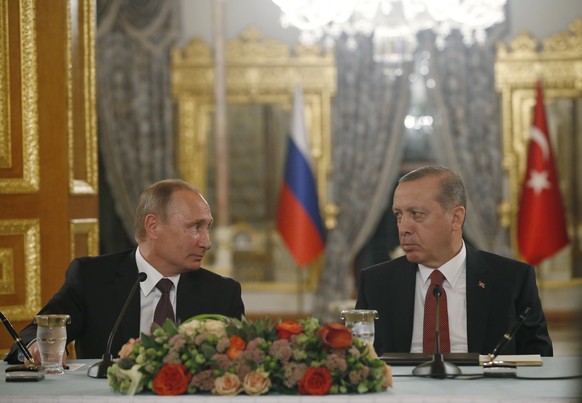 Turkey&#039;s President Recep Tayyip Erdogan, right and Russian President Vladimir Putin, left, look at each other during a news conference following their meeting in Istanbul, Monday, Oct. 10, 2016.  ...