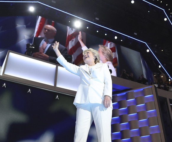 epa05446559 Democratic Presidential nominee Hillary Clinton arrives to speak on stage during final day of the Democratic National Convention at the Wells Fargo Center in Philadelphia, Pennsylvania, US ...