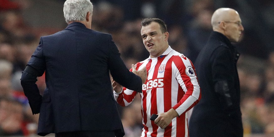 Britain Football Soccer - Stoke City v Swansea City - Premier League - bet365 Stadium - 31/10/16
Stoke City&#039;s Xherdan Shaqiri with Stoke City manager Mark Hughes after going off injured 
Reuter ...