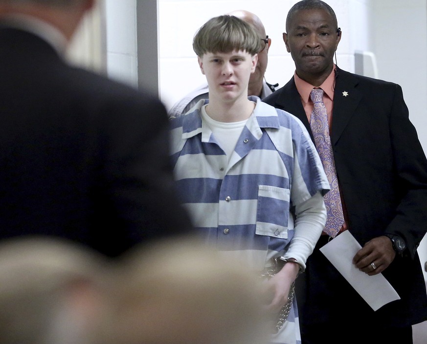 Dylann Roof enters the court room at the Charleston County Judicial Center Monday, April 10, 2017, to enter his guilty plea on murder charges in Charleston, S.C. The convicted Charleston church shoote ...