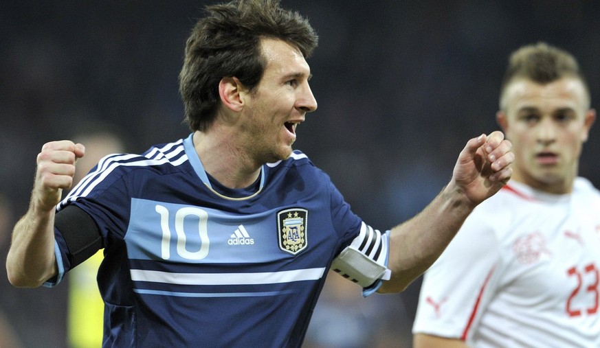 Argentina&#039;s Captain Lionel Messi, left, celebrates after scoring a goal next to Switzerland&#039;s Xherdan Shaqiri, right, during a friendly soccer match between Switzerland and Argentina at the  ...