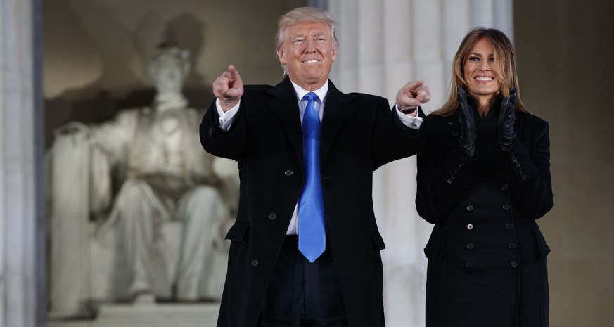 President-elect Donald Trump, left, and his wife Melania Trump arrive to the &quot;Make America Great Again Welcome Concert&quot; at the Lincoln Memorial, Thursday, Jan. 19, 2017, in Washington. (AP P ...