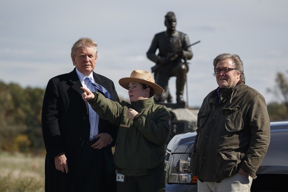 Interpretive park ranger Caitlin Kostic, center, gives a tour near the high-water mark of the Confederacy at Gettysburg National Military Park to Republican presidential candidate Donald Trump, left,  ...