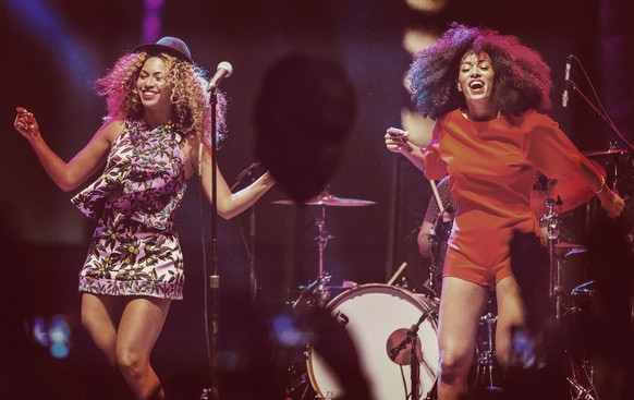 INDIO, CA - APRIL 12: (EDITORS NOTE: Image was processed using Digital Filters) Singer Beyonce (L) performs with her sister Solange onstage during day 2 of the 2014 Coachella Valley Music &amp; Arts F ...