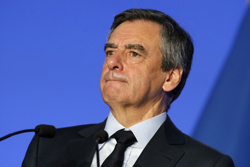 French conservative presidential candidate Francois Fillon ponders a question as he presents his program in Paris, Monday, March 13, 2017. Once the front-runner in the race for the April 23-May 7 elec ...