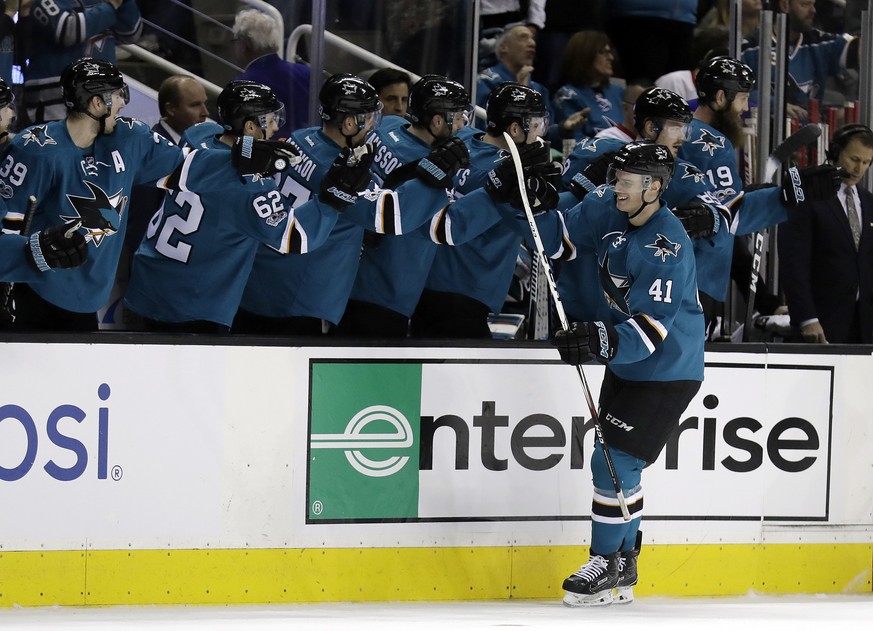 San Jose Sharks&#039; Mirco Mueller (41) celebrates his goal with teammates on the bench during the first period of an NHL hockey game against the Detroit Red Wings Saturday, Jan. 7, 2017, in San Jose ...