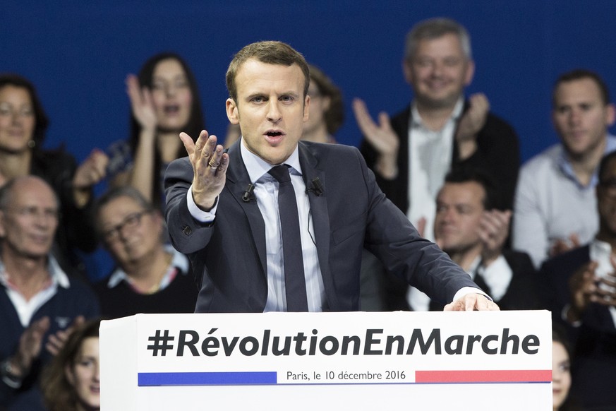 FILE - In this Saturday, Dec. 10, 2016 file picture, former French Economy Minister and candidate for next year&#039;s presidential election, Emmanuel Macron gestures as he delivers his speech during  ...