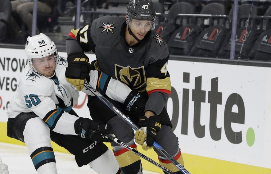 Vegas Golden Knights&#039; Luca Sbisa, right, battles for the puck with San Jose Sharks&#039; Chris Tierney during the second period of an NHL preseason hockey game Sunday, Oct. 1, 2017, in Las Vegas. ...