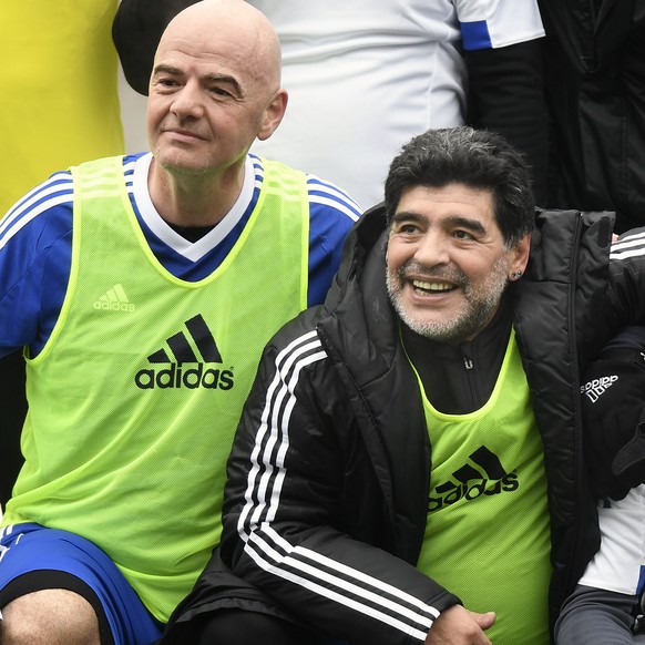 FIFA President Gianni Infantino, Argentina&#039;s former soccer player Diego Maradona and former Swiss player Jean-Paul Brigger, from left, during a football game with FIFA Legends at the Home of FIFA ...