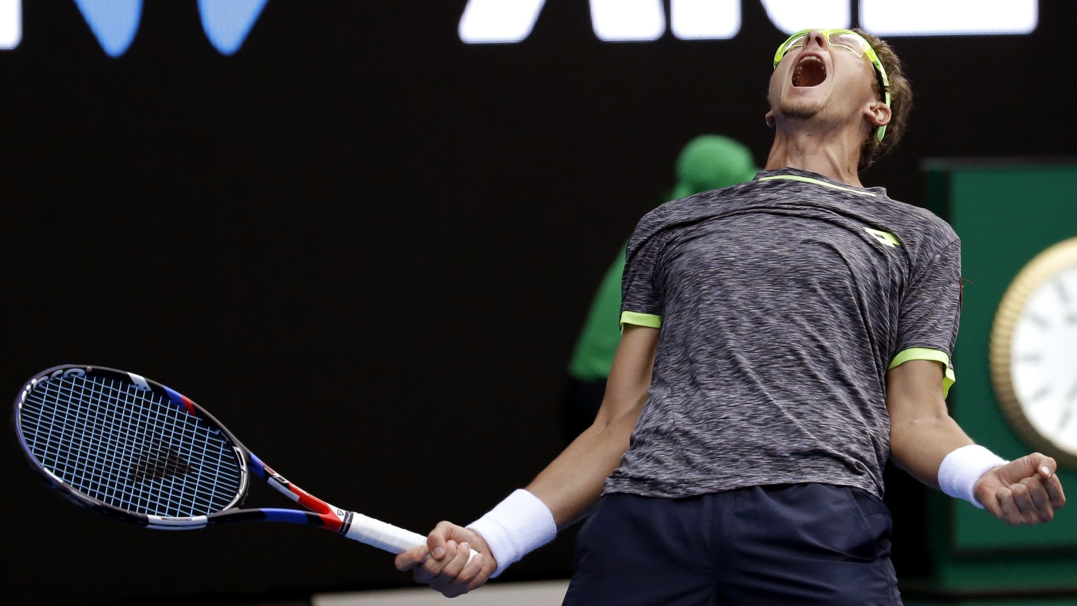 Uzbekistan&#039;s Denis Istomin celebrates after defeating Serbia&#039;s Novak Djokovic in their second round match at the Australian Open tennis championships in Melbourne, Australia, Thursday, Jan.  ...