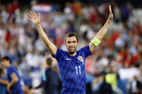 epa05382649 Croatia&#039;s Darijo Srna celebrates after the UEFA EURO 2016 group D preliminary round match between Croatia and Spain at Stade de Bordeaux in Bordeaux, France, 21 June 2016. Croatia won ...