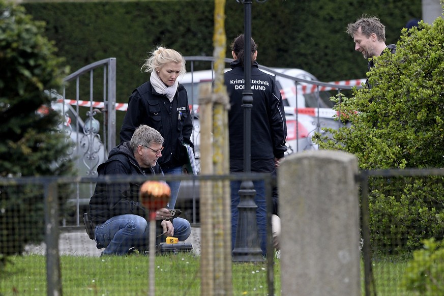 epa05904216 Forensic experts examine the site next to the L&#039;arrivee Hotel in Dortmund, Germany, 12 April 2017, after the team bus of German soccer team Borussia Dortmund was hit here by three exp ...