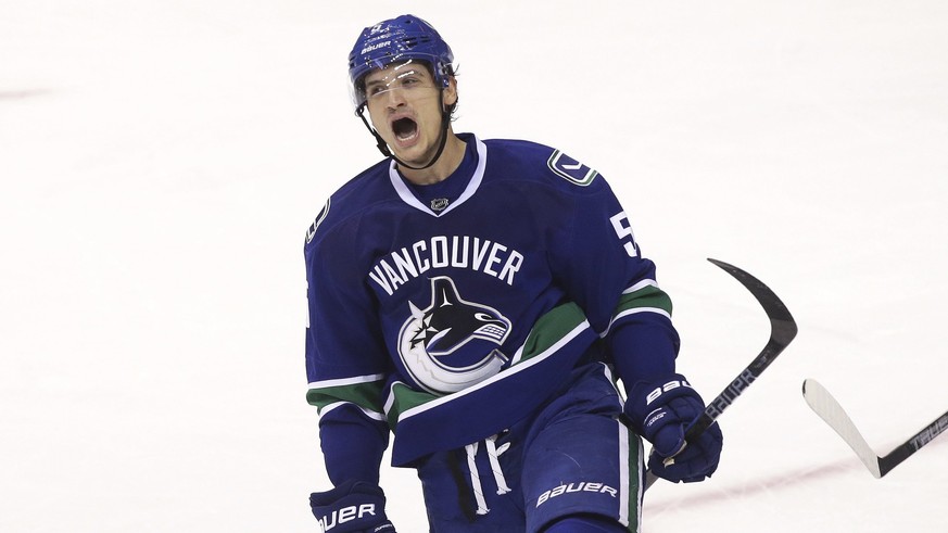 Vancouver Canucks&#039; Luca Sbisa (5) celebrates his goal against the Tampa Bay Lightning during the second period of an NHL hockey game in Vancouver, British Columbia, Friday, Dec. 16, 2016. (Ben Ne ...