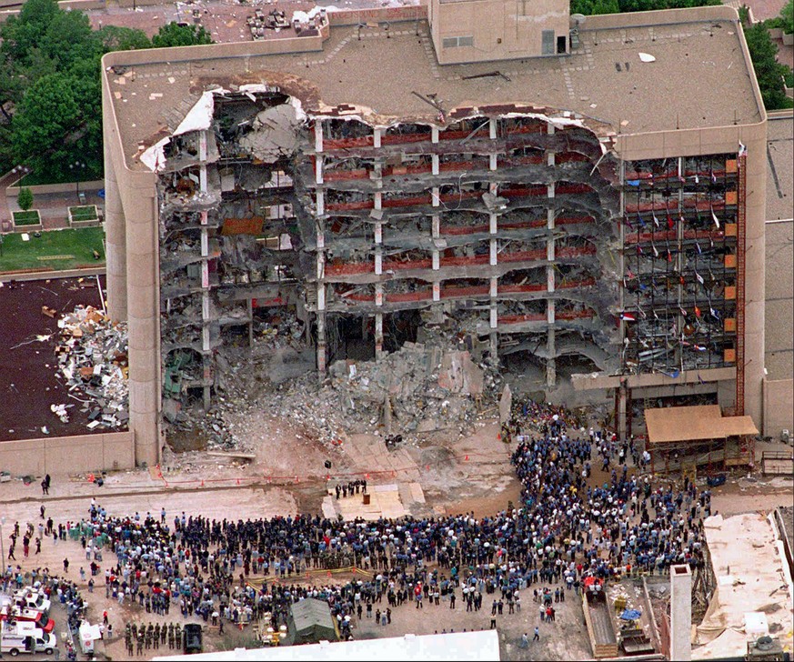 FILE - In this May 5, 1995 file photo, a large group of search and rescue crew attends a memorial service in front of the Alfred P. Murrah Federal Building in Oklahoma City. The blast killed 168 peopl ...