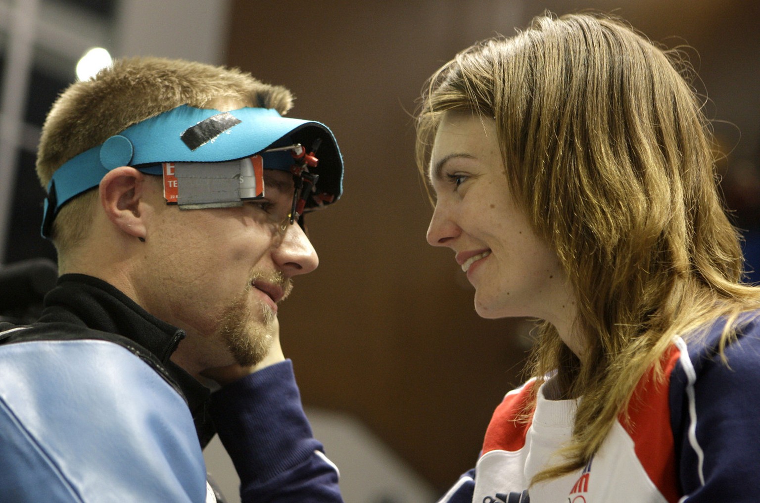 United States silver medalist Matthew Emmons, left, and his wife, Czech Republic gold medalist Katarina Emmons share a moment after the men&#039;s 50 meter rifle prone final round at the Beijing 2008  ...