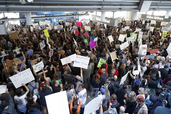 Hundreds of people demonstrate in the lower roadway outside Tom Bradley International Terminal as protests against President Donald Trump&#039;s executive order banning travel from seven Muslim-majori ...