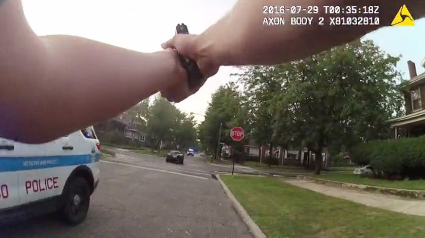 A Chicago police officer is seen shooting his weapon at a moving car (C) in this still image from video taken from a body camera released by the Chicago police in Chicago, Illinois, U.S. July 28, 2016 ...