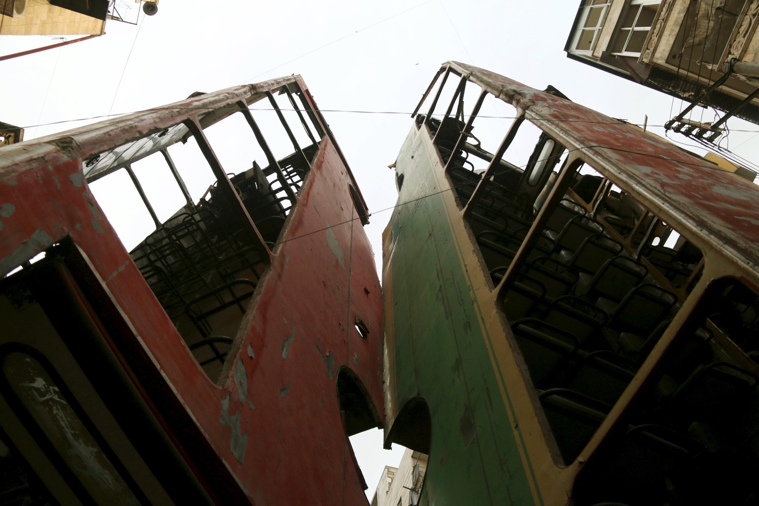 Buses barricading a street, which serve as protection from snipers loyal to Syria&#039;s President Bashar al-Assad, are pictured in Aleppo&#039;s rebel-controlled Bustan al-Qasr neighbourhood March 21 ...