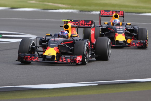 Red Bull driver Max Verstappen and Red Bull driver Daniel Ricciardo of Australia, right, steer their cars during the third free practice at the Silverstone racetrack, Silverstone, England, Friday, Jul ...