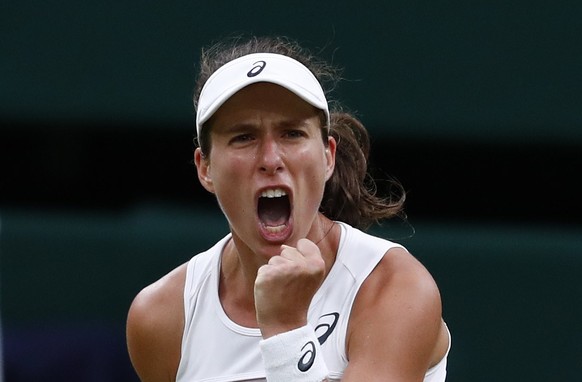 epa06082827 Johanna Konta of Britain in action against Simona Halep of Romania during their quarter final match for the Wimbledon Championships at the All England Lawn Tennis Club, in London, Britain, ...