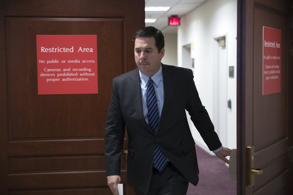 epa05867891 Chairman of the House Permanent Select Committee on Intelligence Devin Nunes walks from a secure area to a press conference on Capitol Hill in Washington, DC, USA, 24 March 2017. Chairman  ...