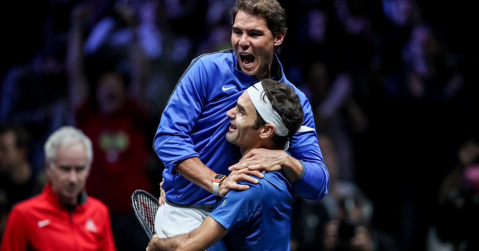 epaselect epa06224920 Switzerland&#039;s Roger Federer (down) and Spain&#039;s Rafael Nadal of the Team Europe celebrate after winning the Laver Cup tennis tournament in Prague, Czech Republic, 24 Sep ...