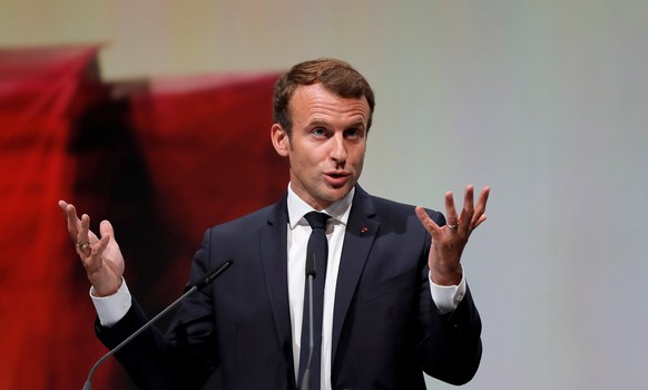 epa06257228 French President Emmanuel Macron delivers a speech during the opening ceremony of the Frankfurt Book Fair at Messe Frankfurt, in Frankfurt am Main, Germany, 10 October 2017. The book fair  ...