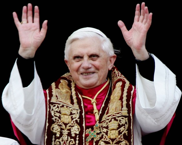 A photograph dated 19 April 2005 showing the newly elected Pope Benedict XVI as he greets pilgrims while standing on the balcony of Saint Peter&#039;s Basilica, in the Vatican, after his election. Car ...